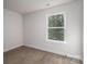 Bright bedroom with a large window overlooking a lush green view at 1941 32Nd Ne St, Hickory, NC 28601