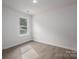 A bedroom with a window overlooking a grassy neighborhood at 1941 32Nd Ne St, Hickory, NC 28601