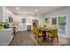 Bright kitchen with stainless steel appliances, white cabinets, and a dining area with sliding door access to the backyard at 1941 32Nd Ne St, Hickory, NC 28601