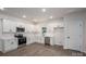 Well-lit modern kitchen with stainless steel appliances, white cabinets and wood-look flooring at 1941 32Nd Ne St, Hickory, NC 28601