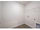 A utility area with modern gray flooring and a handy wire rack shelf at 1941 32Nd Ne St, Hickory, NC 28601