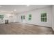 Open-concept living area with wood-look flooring, natural light and access to a deck at 1941 32Nd Ne St, Hickory, NC 28601