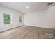 Living area with wood-look flooring, natural light and staircase to a second floor at 1941 32Nd Ne St, Hickory, NC 28601