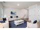 Comfortable living room with hardwood floors, a plush sofa, stylish decor, and a staircase leading to the upper level at 1941 32Nd Ne St, Hickory, NC 28601