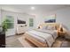 Serene main bedroom with natural light, hardwood floors, neutral colors, and stylish furnishings for a relaxing retreat at 1941 32Nd Ne St, Hickory, NC 28601