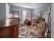 Traditional bedroom with four-poster bed, floral patterns, wooden furniture, and natural light at 204 N Gaston St, Kings Mountain, NC 28086