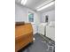 A spacious laundry room with a washer, dryer, a window for natural light, and ample storage space at 204 N Gaston St, Kings Mountain, NC 28086