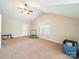 Spacious bedroom with vaulted ceiling, ceiling fan, one window and carpeted floor at 2111 Elendil Ln, Charlotte, NC 28269