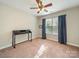 Bright and airy bedroom with a dark wood desk and a window with natural light, perfect for a home office at 2111 Elendil Ln, Charlotte, NC 28269