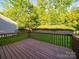 Well-maintained wooden deck, perfect for outdoor relaxation and entertaining with serene views at 2111 Elendil Ln, Charlotte, NC 28269