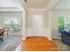 Inviting foyer with hardwood floors, decorative molding, and views into the living and dining areas at 2111 Elendil Ln, Charlotte, NC 28269