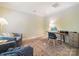 Cozy home office featuring natural light, a stylish desk, comfortable seating, and a patterned rug at 2111 Elendil Ln, Charlotte, NC 28269