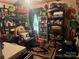 Office features a variety of horror and other decorations, multiple shelves, and ample storage space at 2165 Peanuts Ln, Newton, NC 28658