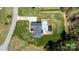 Aerial view showcasing the home's layout, pool, patio, and expansive landscaped yard at 2458 Genelia Dr, Claremont, NC 28610