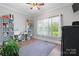 Bright bedroom with a large window, neutral walls, wood floor and a blue area rug at 2458 Genelia Dr, Claremont, NC 28610