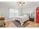 Modest bedroom with wood floors, a ceiling fan, natural light and a white comforter at 2458 Genelia Dr, Claremont, NC 28610