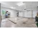 Spacious two-car garage with high ceilings, offering plenty of room for vehicles and storage at 2458 Genelia Dr, Claremont, NC 28610
