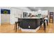Kitchen island with bar seating, granite countertops and white cabinetry at 2458 Genelia Dr, Claremont, NC 28610