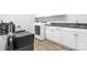 Bright laundry room featuring a modern washer and dryer, complemented by ample cabinet space and sleek countertops at 2458 Genelia Dr, Claremont, NC 28610