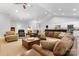 Bright, open living room with hardwood floors, vaulted ceilings, and modern lighting at 2458 Genelia Dr, Claremont, NC 28610