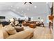 Spacious living room with vaulted ceilings, hardwood floors, and a large leather sectional at 2458 Genelia Dr, Claremont, NC 28610