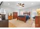 Spacious main bedroom with wooden furnishings and a ceiling fan at 2458 Genelia Dr, Claremont, NC 28610