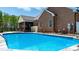 A stunning backyard pool with an adjacent covered patio at 2458 Genelia Dr, Claremont, NC 28610