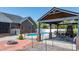 The pool and patio feature a fireplace, seating, and lighting for outdoor living at 2458 Genelia Dr, Claremont, NC 28610