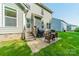 Home's backyard patio offers great space for outdoor dining with furniture and BBQ grill at 2714 Woodlands Creek Dr, Monroe, NC 28110