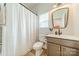 Clean bathroom with shower, toilet, modern sink, and minimalist mirror at 2714 Woodlands Creek Dr, Monroe, NC 28110