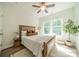 Inviting bedroom features a cozy bed, natural light, and calming neutral tones at 2714 Woodlands Creek Dr, Monroe, NC 28110