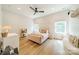 Bright, stylish bedroom with plush bed, hardwood floors, and two windows offering natural light at 2714 Woodlands Creek Dr, Monroe, NC 28110