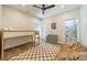 This bedroom includes a bunk bed, ceiling fan, hardwood floors, and an en-suite bathroom at 2714 Woodlands Creek Dr, Monroe, NC 28110