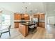 Spacious kitchen with a center island, stainless steel appliances, granite countertops, and ample cabinet space at 2714 Woodlands Creek Dr, Monroe, NC 28110