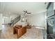 Open living area with stairs, comfortable seating, and lots of natural light at 2714 Woodlands Creek Dr, Monroe, NC 28110