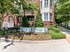 Welcoming entrance to Residences on Selwyn-Tranquil Court, featuring lush landscaping and manicured signage at 2810 Selwyn Ave # 104, Charlotte, NC 28209