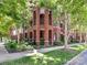 Charming brick condo building with lush landscaping and mature trees at 2810 Selwyn Ave # 104, Charlotte, NC 28209