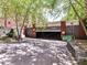 Garage entrance at Tranquil Court featuring trees that provide shade at 2810 Selwyn Ave # 104, Charlotte, NC 28209