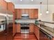 Well-equipped kitchen with stainless steel appliances and granite countertops at 2810 Selwyn Ave # 104, Charlotte, NC 28209