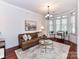 Cozy living room with a comfortable leather sofa and stylish decor at 2810 Selwyn Ave # 104, Charlotte, NC 28209