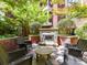 Outdoor patio with an outdoor fireplace and chairs at 2810 Selwyn Ave # 104, Charlotte, NC 28209