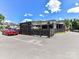 Selwyn Pub showing patio and parking spaces on a beautiful day at 2810 Selwyn Ave # 104, Charlotte, NC 28209