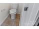 A bathroom with a standard toilet set against neutral-toned tile flooring at 286 Mallard Head Dr, Rock Hill, SC 29732