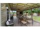Relax on this covered deck, complete with a TV, outdoor seating, and a hammock at 286 Mallard Head Dr, Rock Hill, SC 29732
