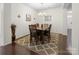 Charming dining room with wood floors, seating for six, and modern chandelier at 286 Mallard Head Dr, Rock Hill, SC 29732