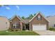 Charming brick home featuring an attached two-car garage and manicured lawn at 286 Mallard Head Dr, Rock Hill, SC 29732
