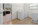Functional laundry room with a washer, dryer, freezer and view into the kitchen at 286 Mallard Head Dr, Rock Hill, SC 29732
