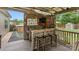 Outdoor bar featuring a grill, granite countertop, seating, and TV at 286 Mallard Head Dr, Rock Hill, SC 29732