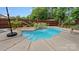 View of the pool with attached waterfall, mature tropical landscaping, and lounge seating at 286 Mallard Head Dr, Rock Hill, SC 29732