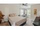 Bright bedroom with soft bedding and carpeted floors at 314 Sunnywood Ln, Charlotte, NC 28270